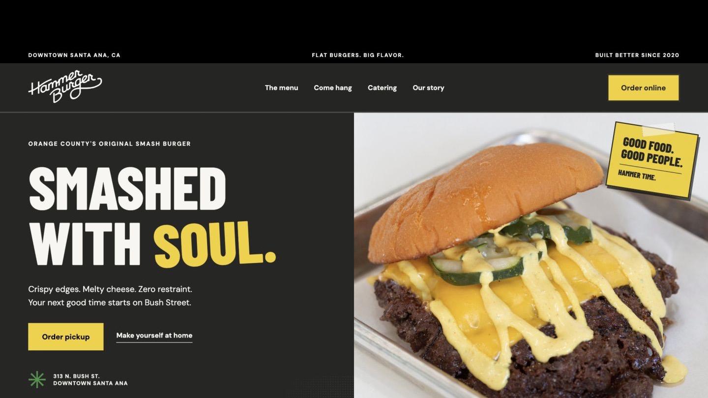 Full-width Hammer Burger desktop homepage with custom typography and food photography